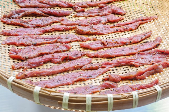 Homemade beef jerky on threshing basket