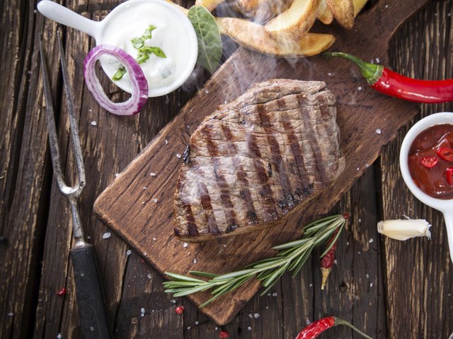 Beef steak on wooden table