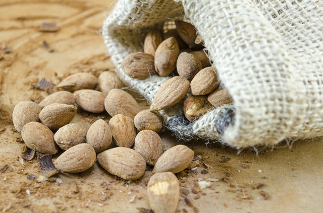Salty almonds falling out of a bag