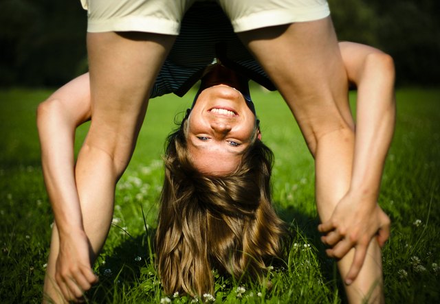 Young woman with her head upside down