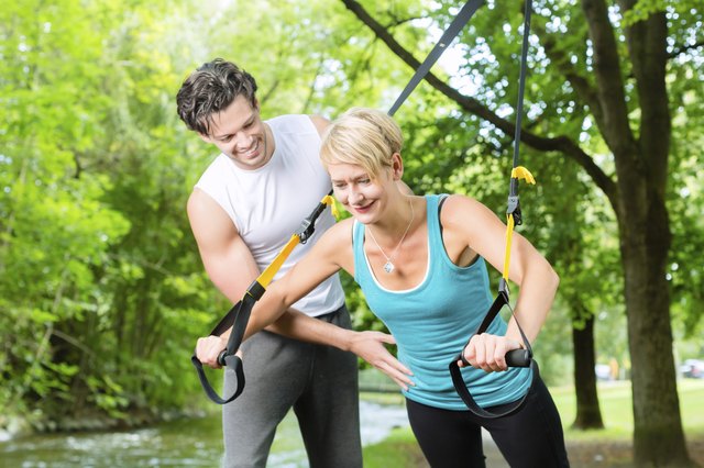 People doing suspension or sling trainer fitness