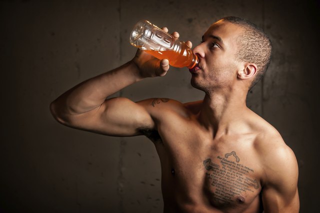 Black male drinking a sports drink