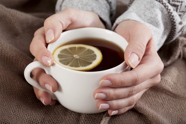 Hands with tea cup