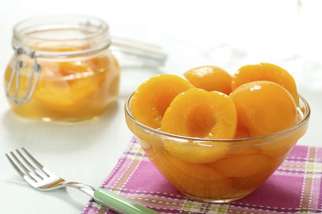​​peach syrup in glass jar