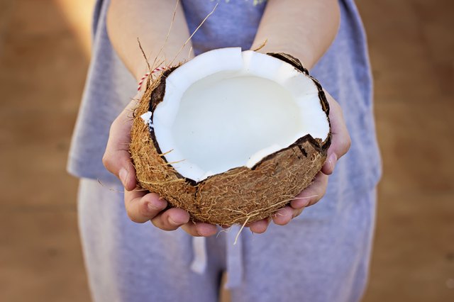 Open coconut in hands