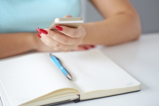 Young woman working with a mobile phone