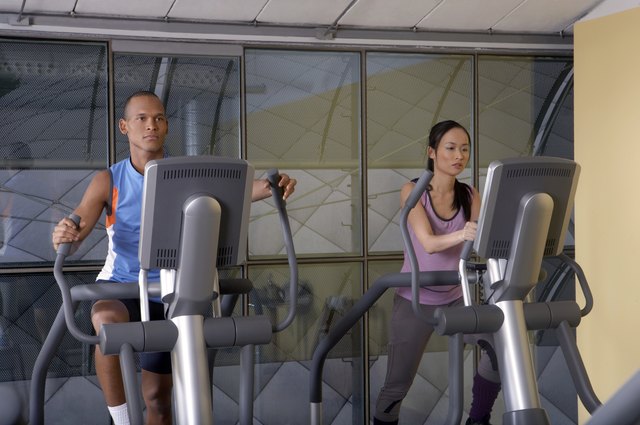 Man and woman working out in the gym.