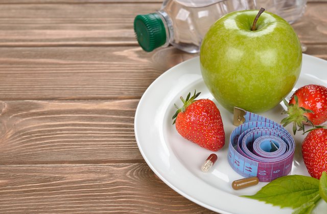 Apple and measuring tape