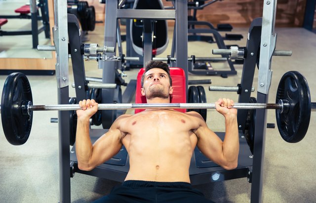 Man doing exercises with barbell