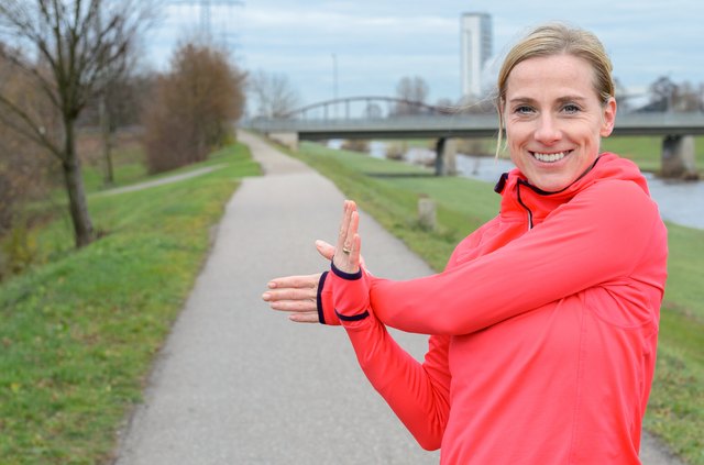 Athletic Adult Woman stretching her arm
