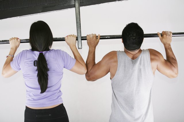 woman and man preparing to do pull ups