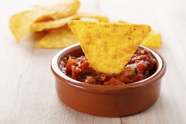 tortilla chip with hot salsa dip