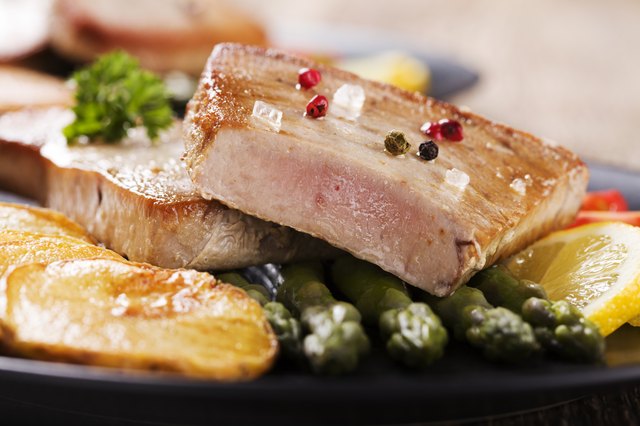 Grilled tuna steak served on asparagus with roasted zmieniakami