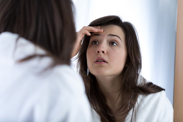 Girl looking in the mirror