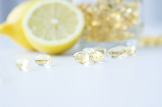 Vitamin capsules and lemons