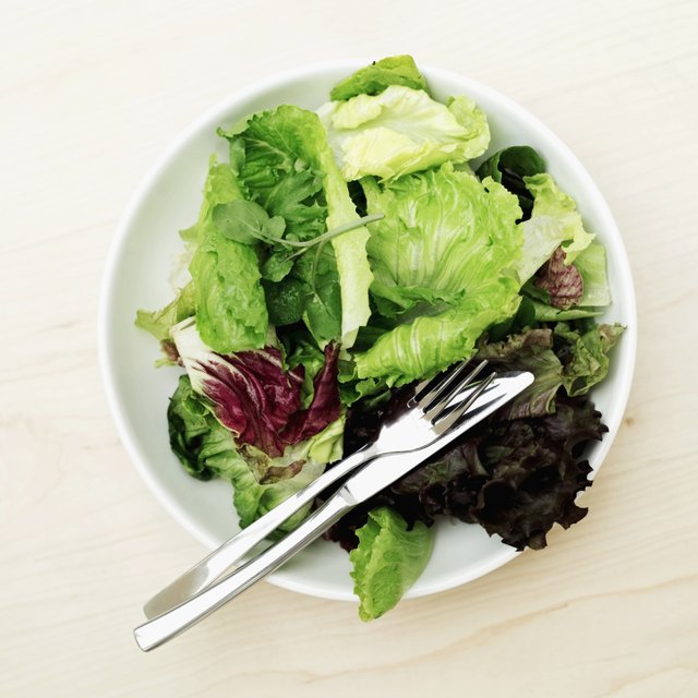 Elevated view of fresh salad greens in a bowl