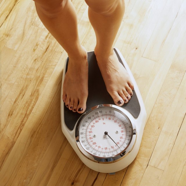 Woman's Feet on a Bathroom Scale