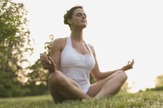 Woman meditating outdoors