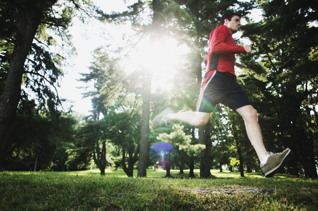 Man running through forest
