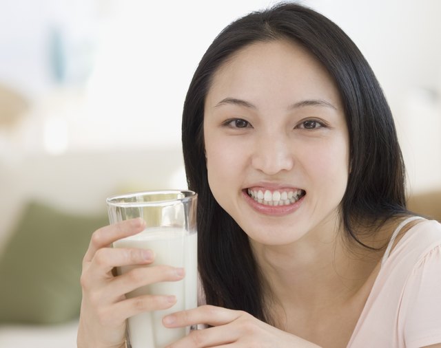 Asian woman drinking milk