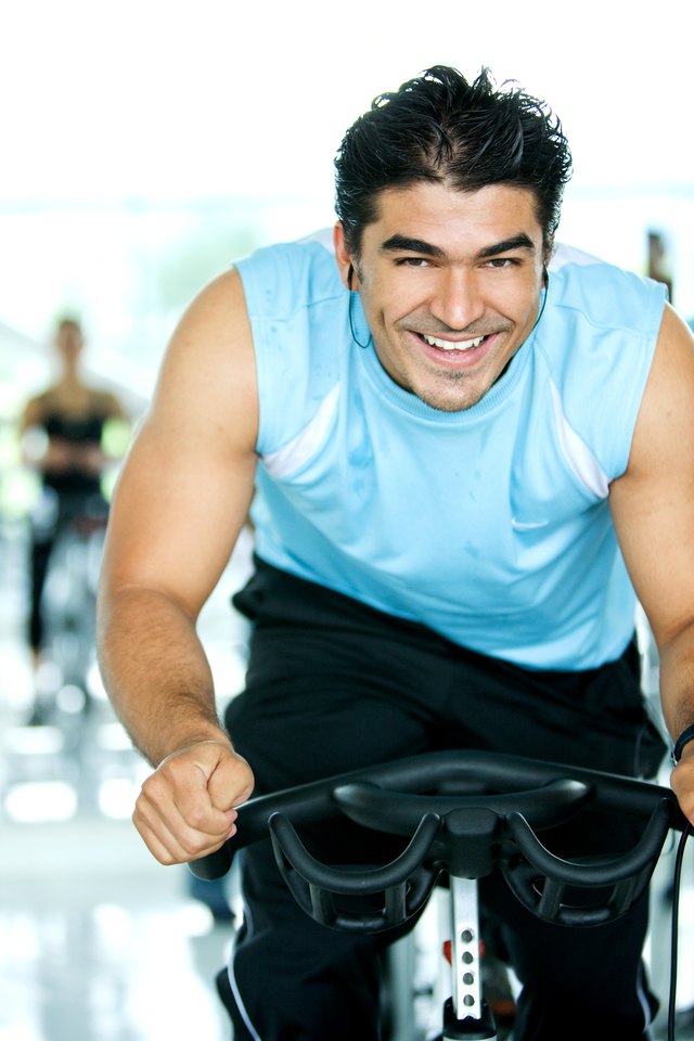 man spinning at the gym