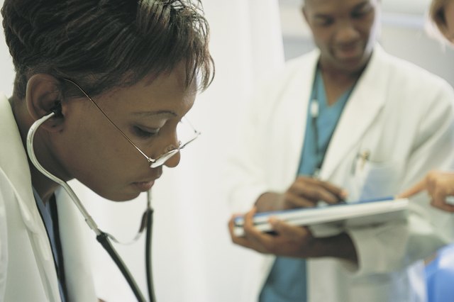 Physician using stethoscope