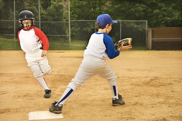 Young boys playing in baseball game