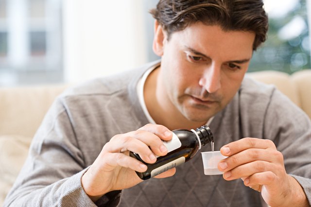 Man pouring medicine