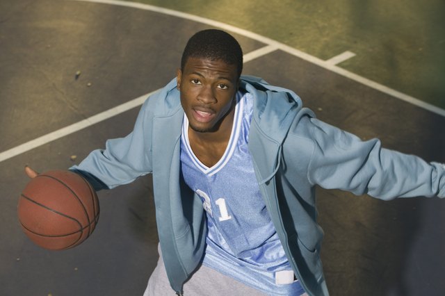 Basketball player dribbling ball