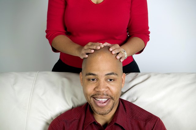 Man with a woman's hands on his head