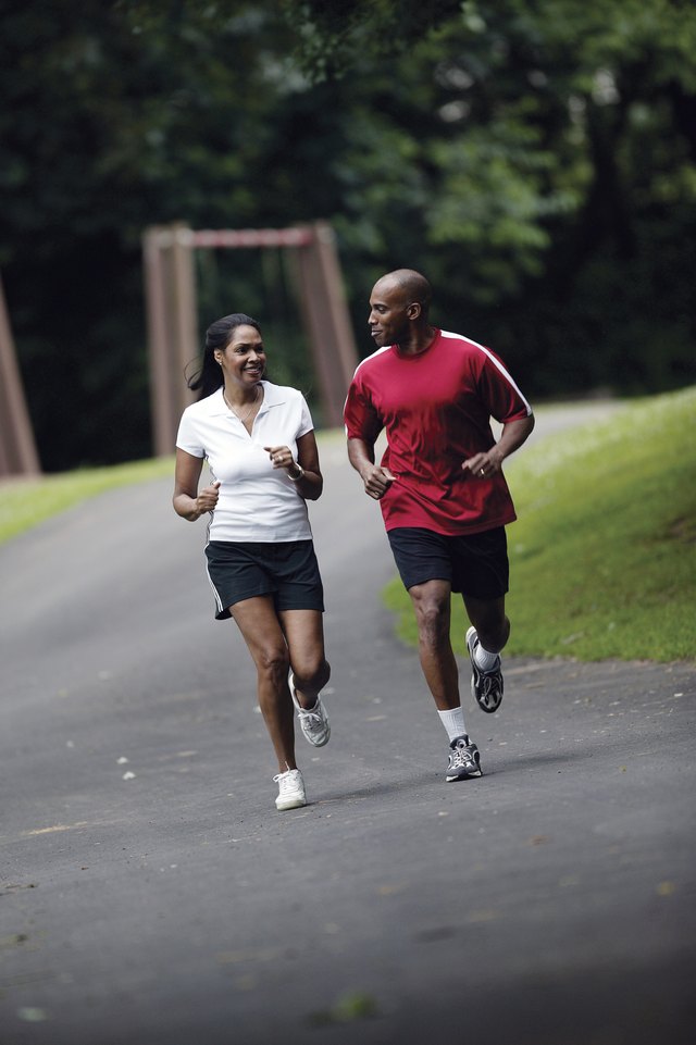 Couple jogging on path
