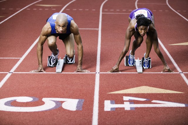 Runners on starting bocks on track