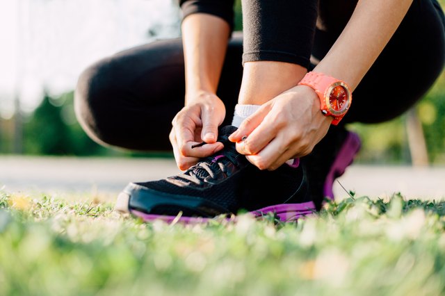 Closeup of a runner preparing his shoes for a run