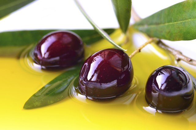 Olives and olive oil closeup