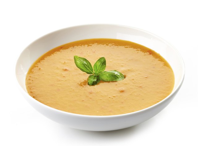 bowl of squash soup with basil