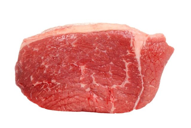 closeup outside round steak on white