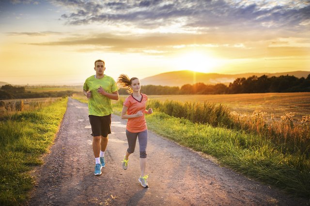 Couple running at sunset