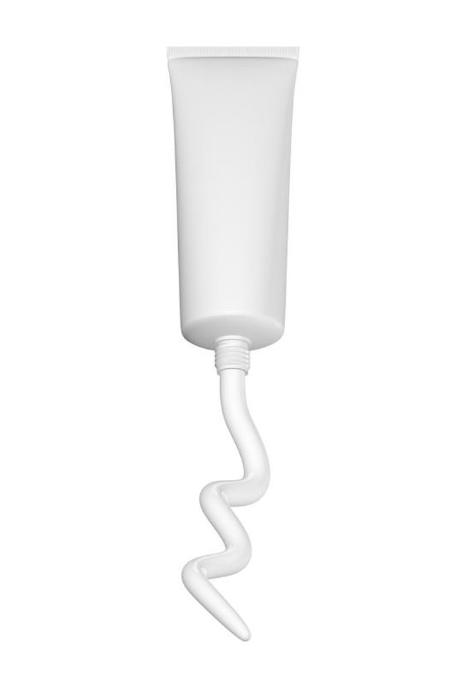 toothpaste, ointment or suntan cream squeezed from a tube on a white background