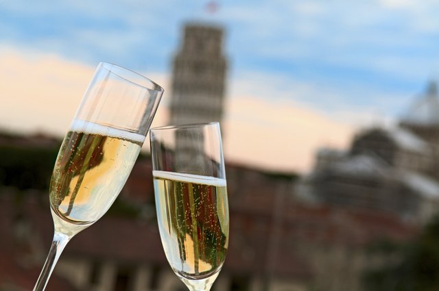 Two glasses of champagne with Pisa's Tower