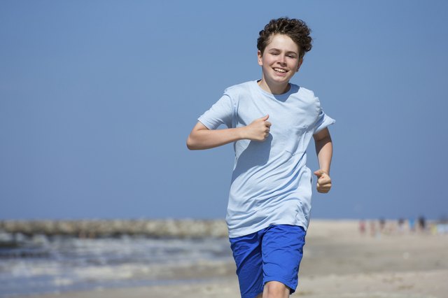 Boy running on beach