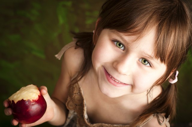 Little girl with apple
