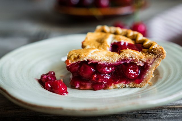 Homemade cherry pie on rustic background