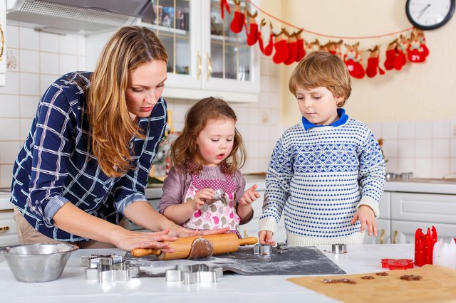 Happy family baking Christmas cookies at home