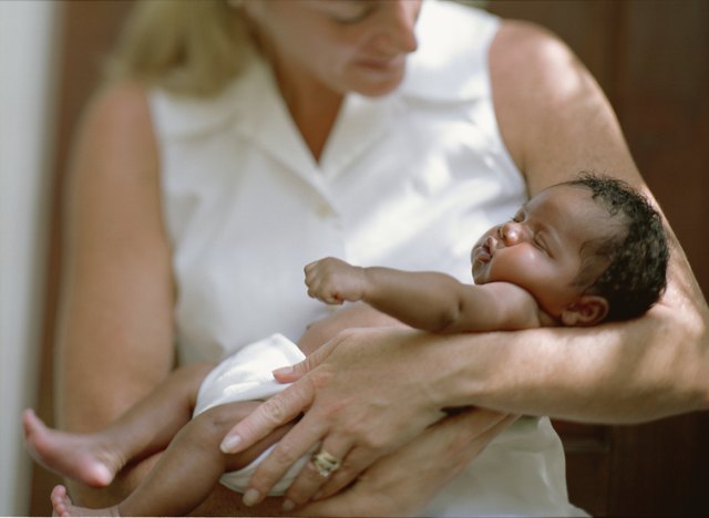 Woman holding a newborn baby
