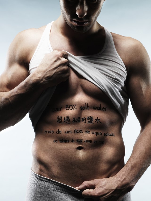 man with words written on stomach