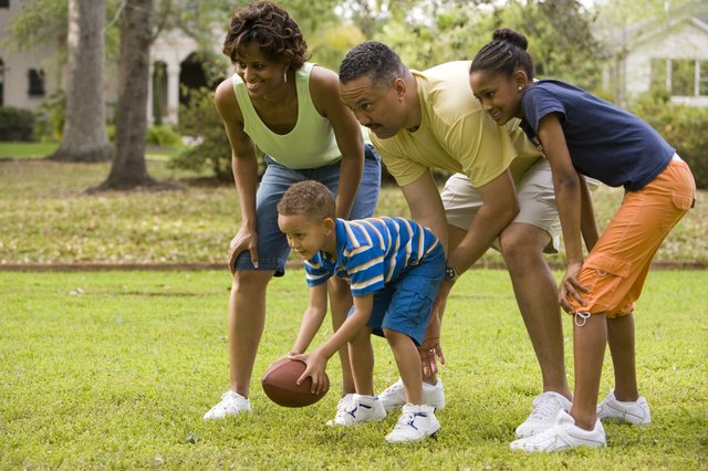 Parents playing with their children at park