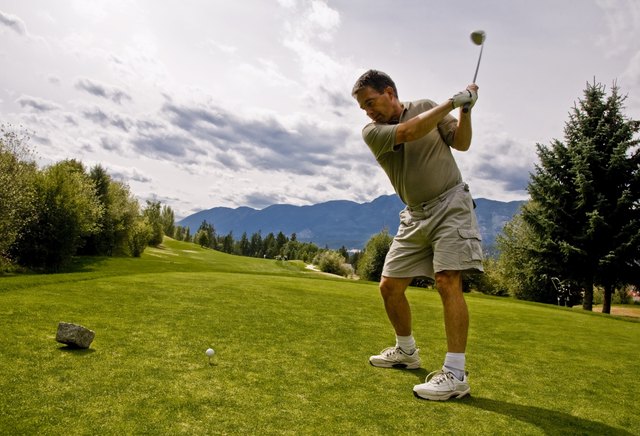 Golfer taking his first shot