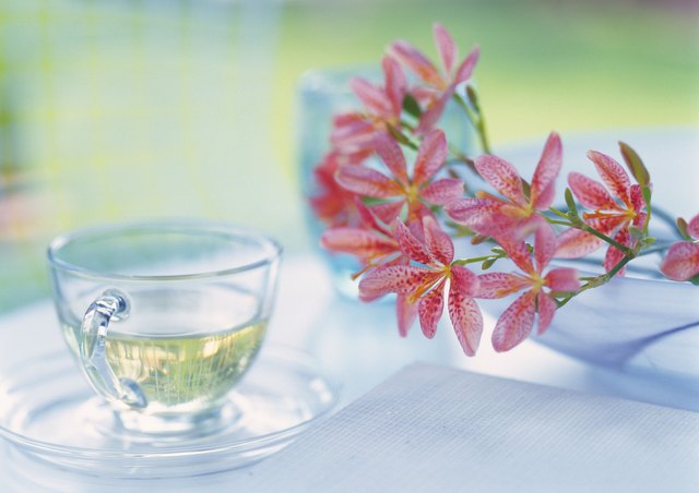 Flowers and Cup of Tea on Table, Close Up, Differential Focus, In Focus, Out Focus