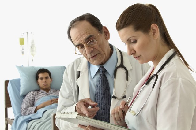 Male doctor and a female doctor discussing a report
