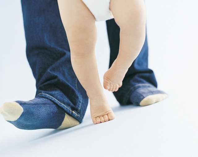 Parent Helping Their Baby to Walk